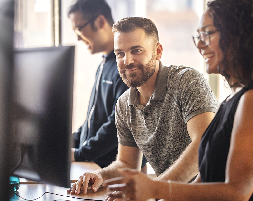 Two Sigma employees happily working together.