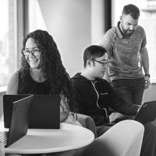 Diverse group of Two Sigma employees smiling.
