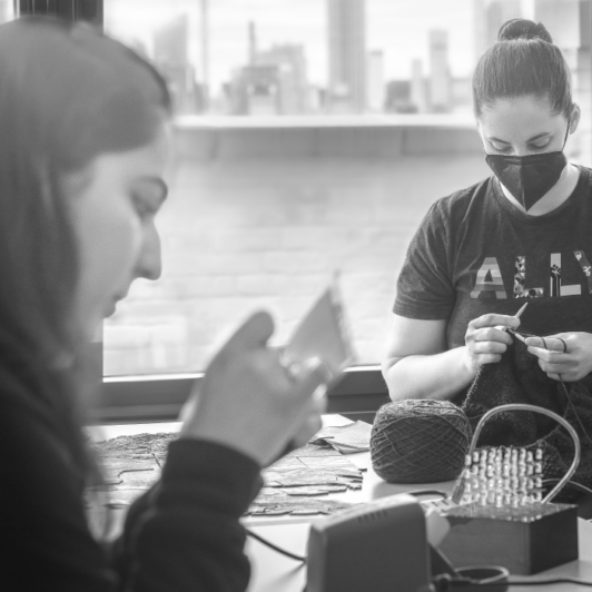 Two Sigma employee wearing a shirt that says 'Ally'.
